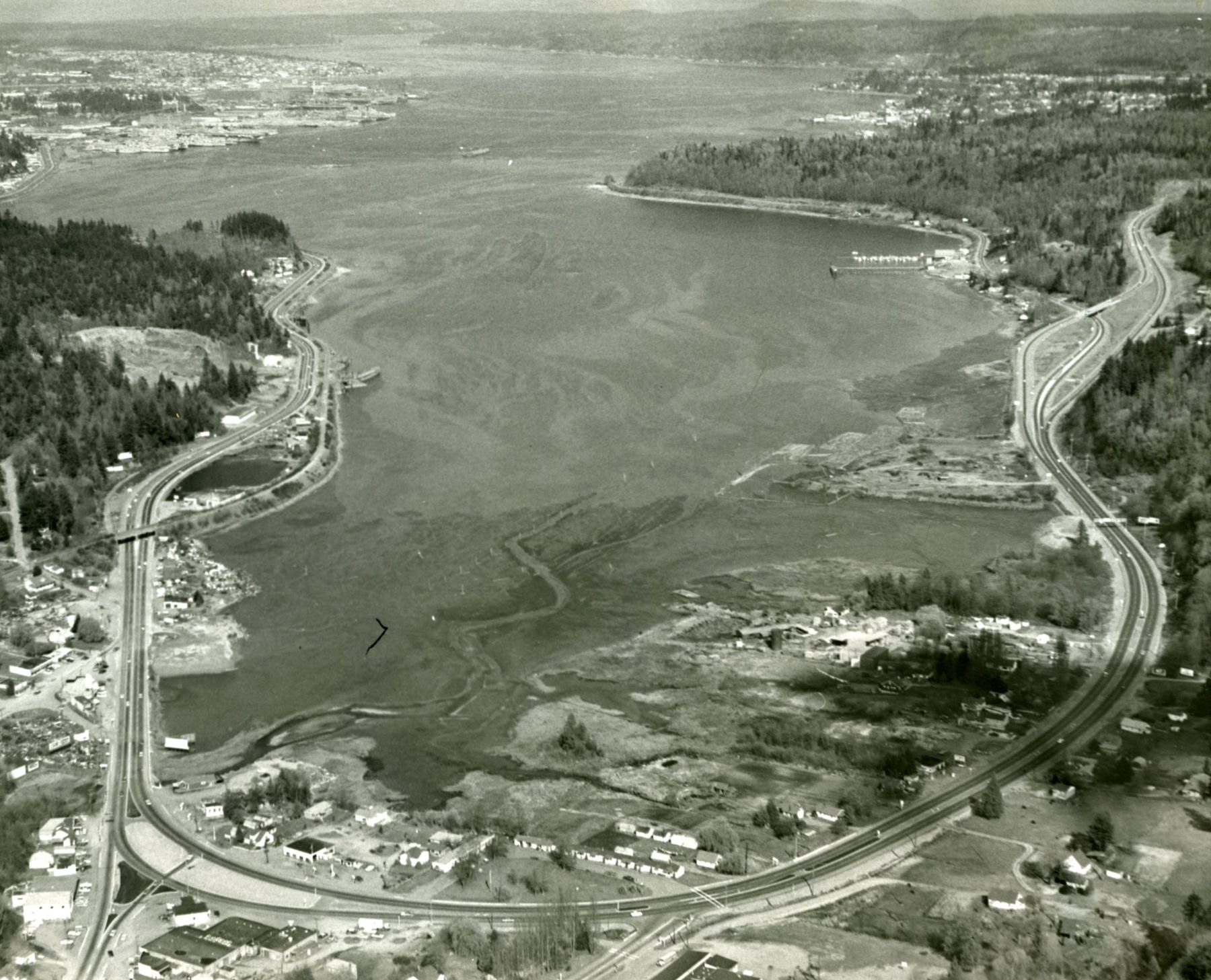 Aerial view of Sinclair Inlet from above Gorst, with highways along the shore and Bremerton in the distance
